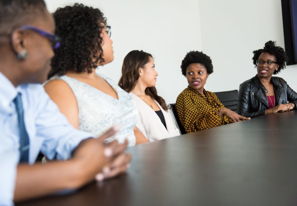 A group of people at a conference table