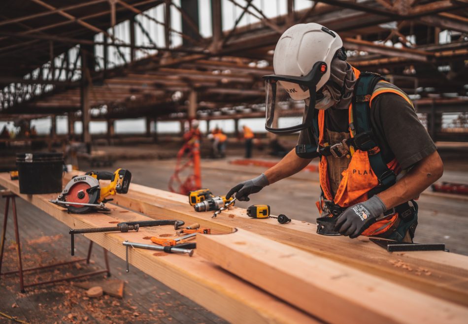 An employee at a work bench at a construction site